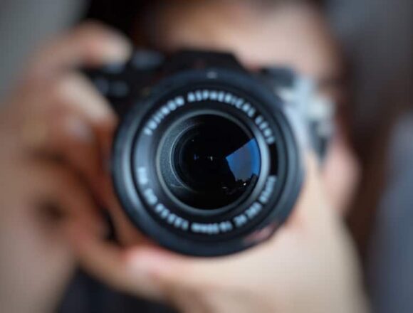 soft,focus,of,women,photographer,hold,camera,and,taking,a